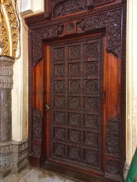 There are many doors inside the palace and all of them have such wooden carvings on them. Each one of them having unique designs.